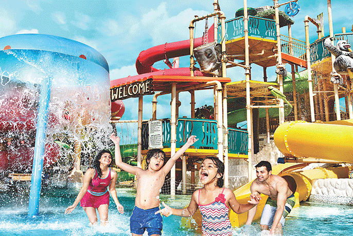 Water Kingdom - a group of children playing in the water at daytime