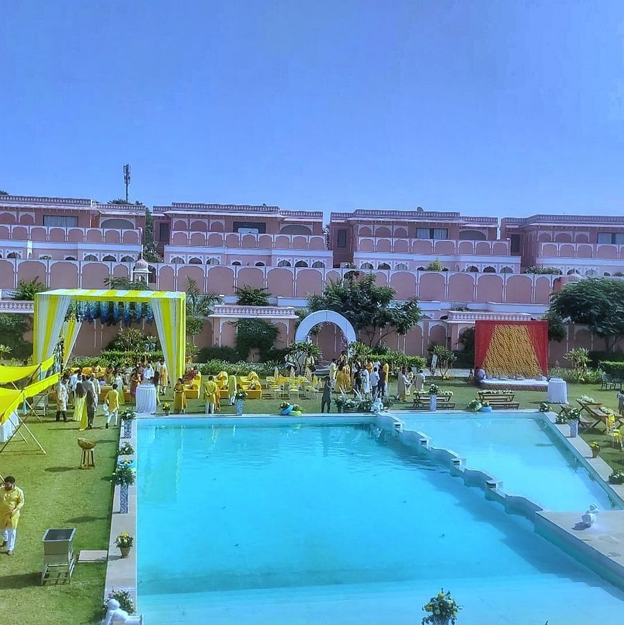 the outside lawn surrounding the swimming pool decorated for a party - Buena Vista