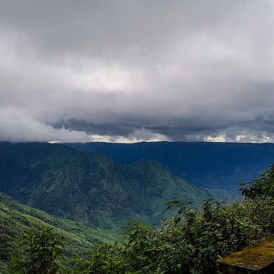 A view of a valley with low hanging clouds