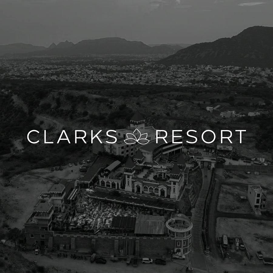 Aerial view of Clarks Resort in monochrome with the text 'CLARKS RESORT' in caps