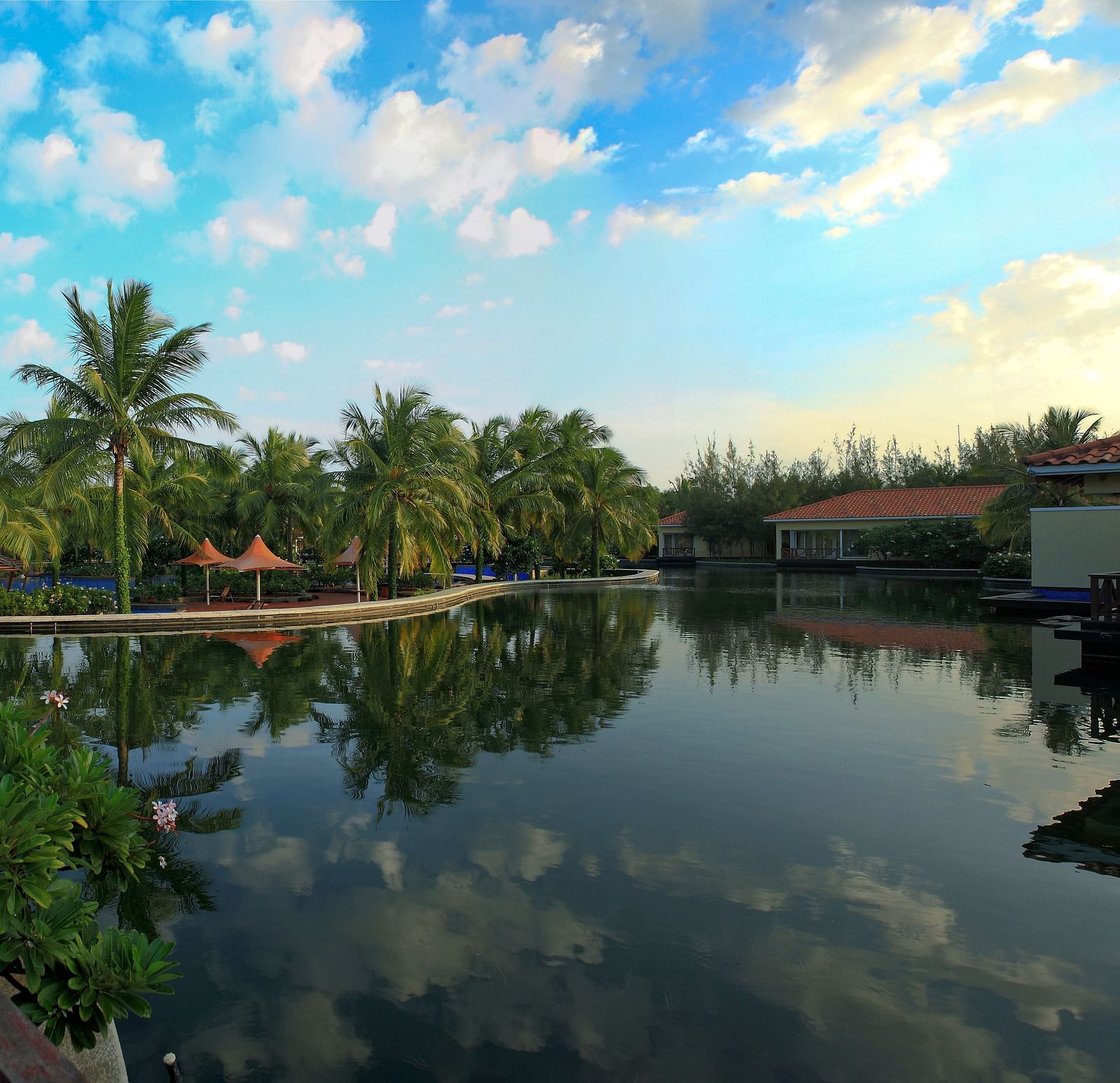 View of Tahiti Exterior with a lake in front of it at Ocean Spray, Pondicherry