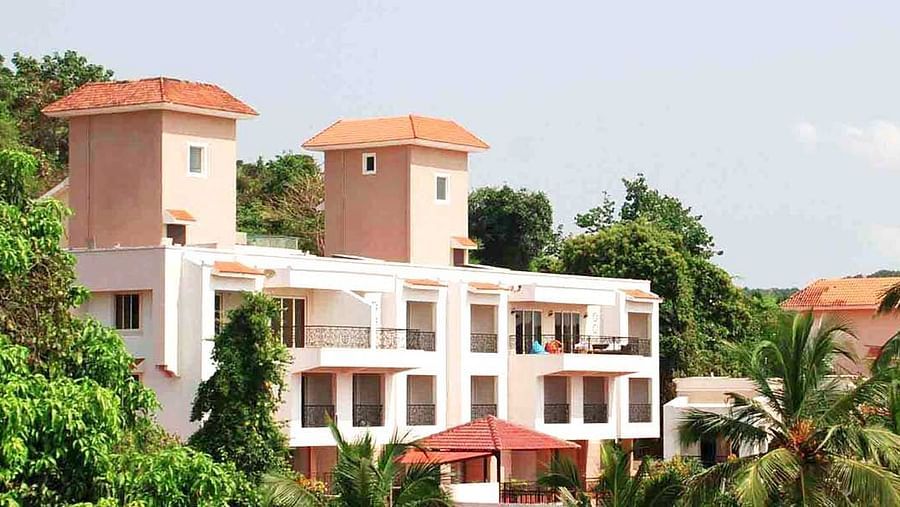 Distant view of La Vida Studio Inn ' at La Vida Studio Inn Goa, showcasing its setting.
