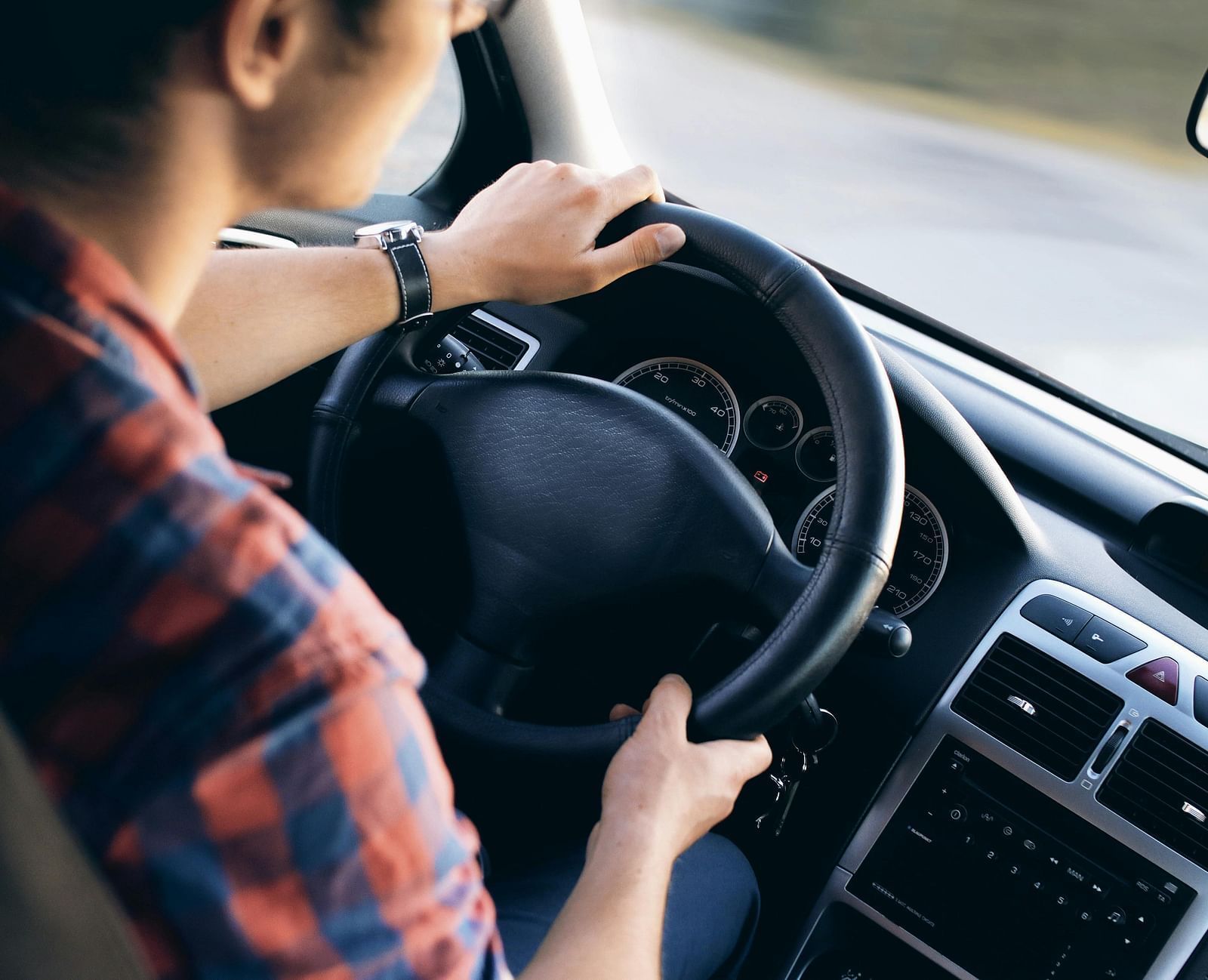 A man driving on the road.