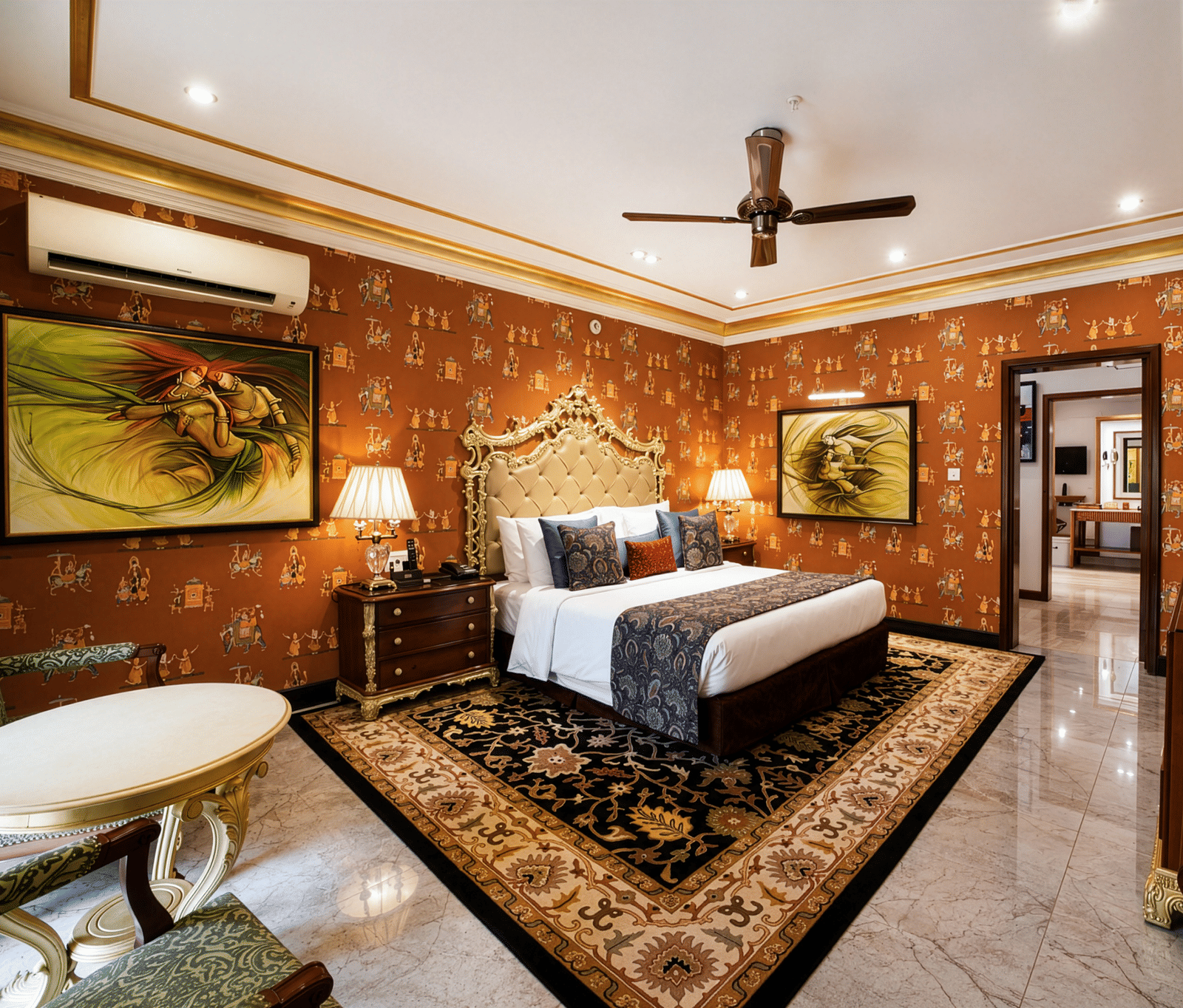 Royal Villa bedroom at Mayfair Lagoon Bhubaneswar featuring a canopied king bed, traditional wall art, chandelier, and a marble-accented seating area