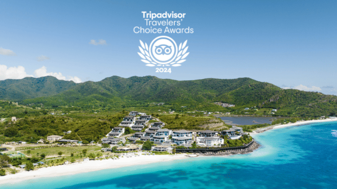 A poster with logo of trip advisor with the background of beach with mountains all around.