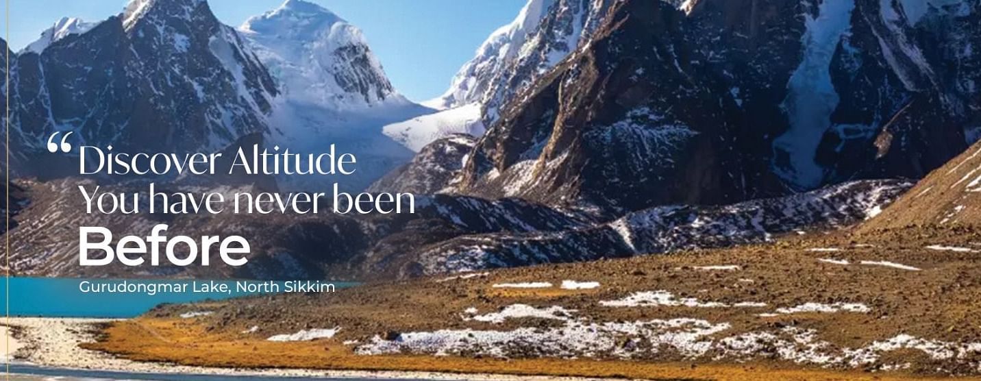 A breathtaking view of mountains and a lake representing Sumi Yashshree's exploration of new destinations.