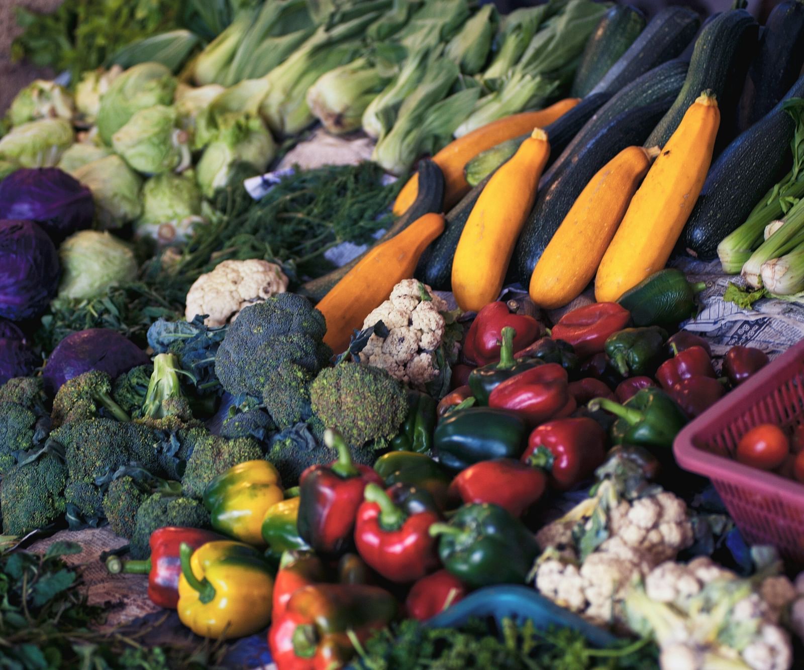 A close up shot of numerous veggies kept on a table to be sold