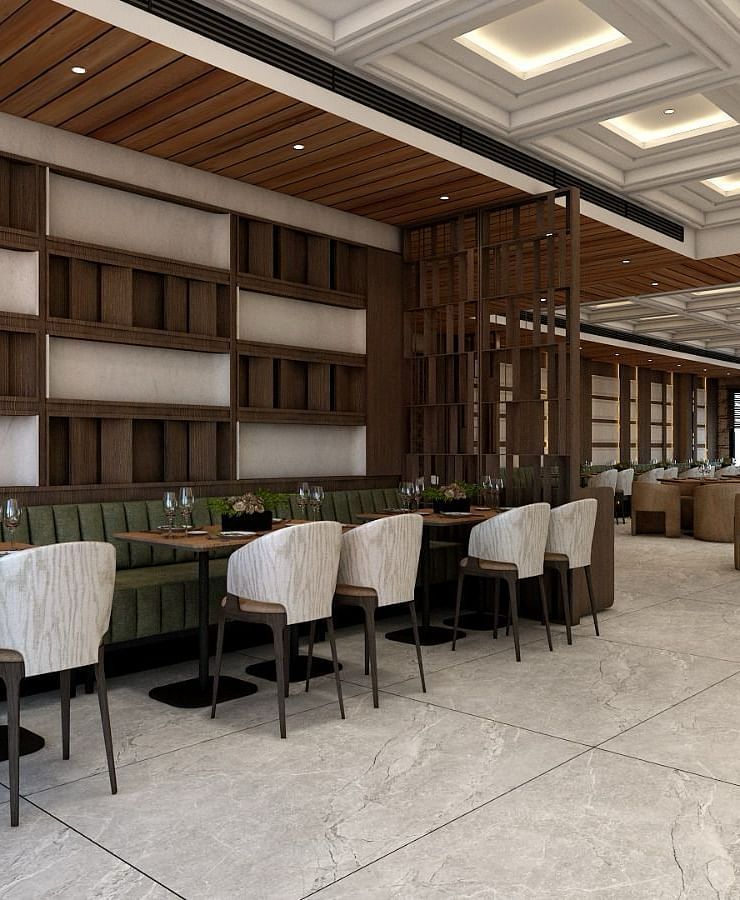 A restaurant with chic and modern interiors with several chairs surrounding the dining tables - Namaste Corbett