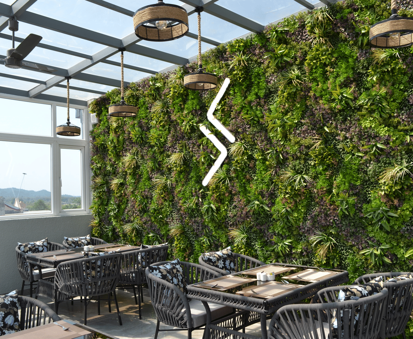 Signum Caf&eacute; on the 4th floor at Signum Tathastu Boutique Hotel, Haridwar, with its living green wall