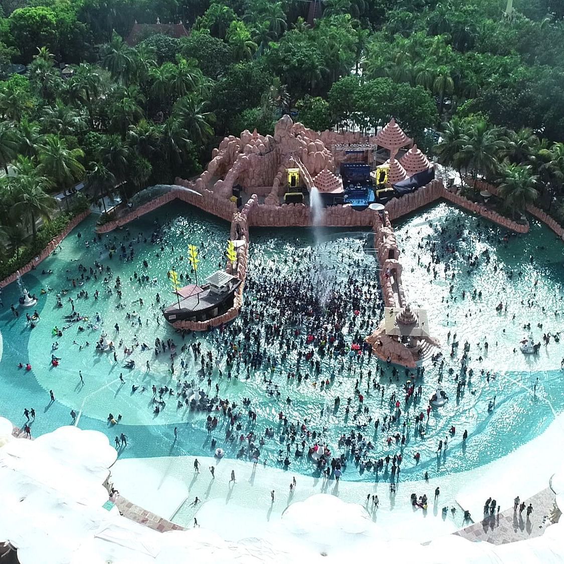 A drone shot of the Wetlantic wave pool where a huge crowd is seen enjoying - Water Kingdom