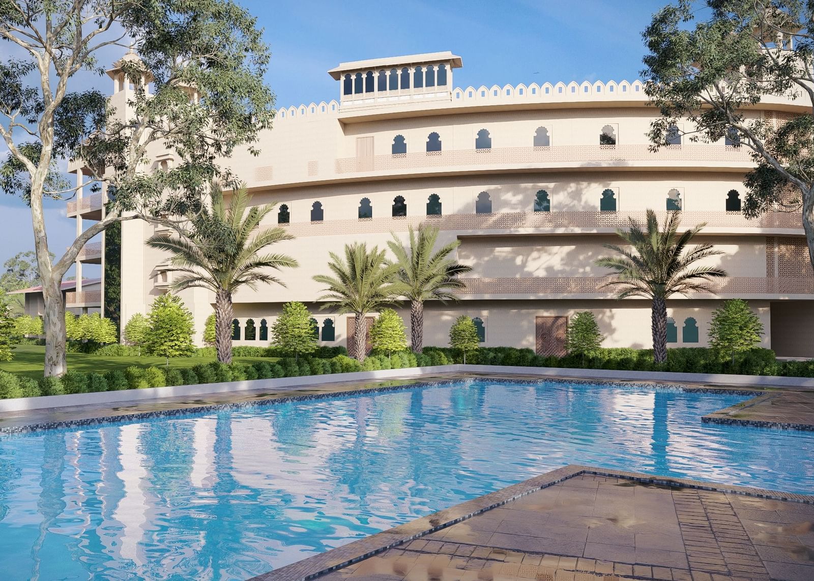 Bamboo Saa Sunrrise Wedding & Wellness Resort, Jaipur, with an outdoor swimming pool and sun loungers in a sunny setting.