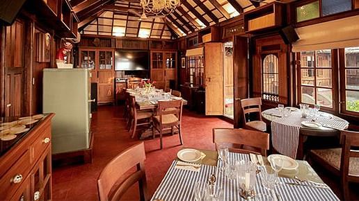 An indoor dining seating at Manger Cafe at Samiira on Ashtamudi Lake.