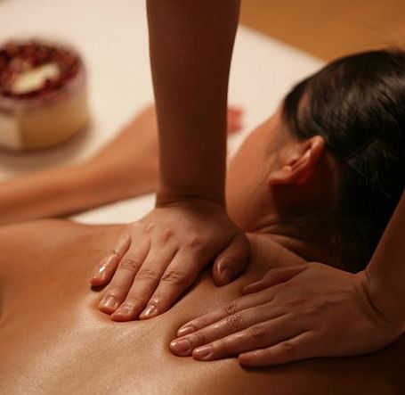 A soothing massage in a tranquil setting, highlighting relaxation and wellness. A perfect escape for rejuvenation | Brewery Gulch Inn & Spa
