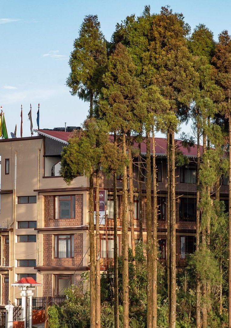 Facade of Image of lush mountain range with trees at Summit Sherpa Mountain Hotel & Spa, Kalimpong