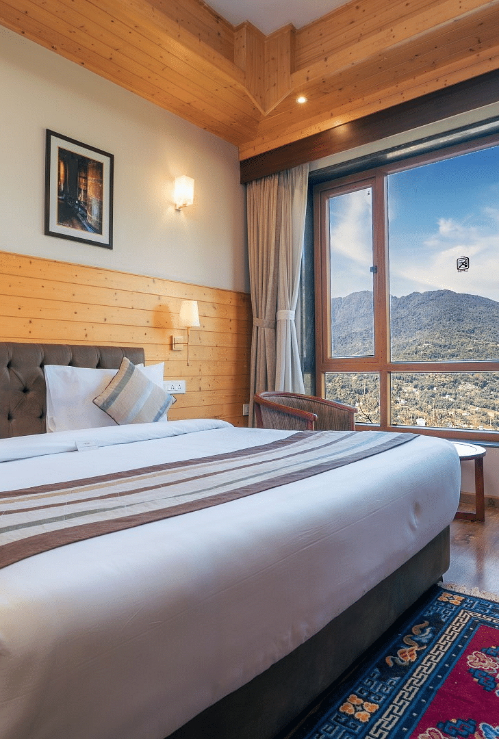 A room at Summit Alpine Abode with a double bed and mountain views