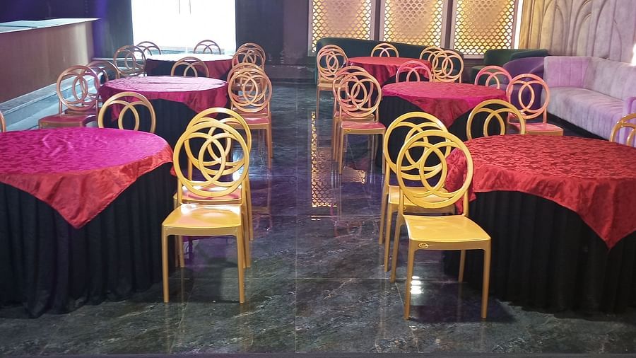 An image of Utsav Banquet hall with several chairs and table set- Bamboo Saa Mulberry Resort, Pushkar