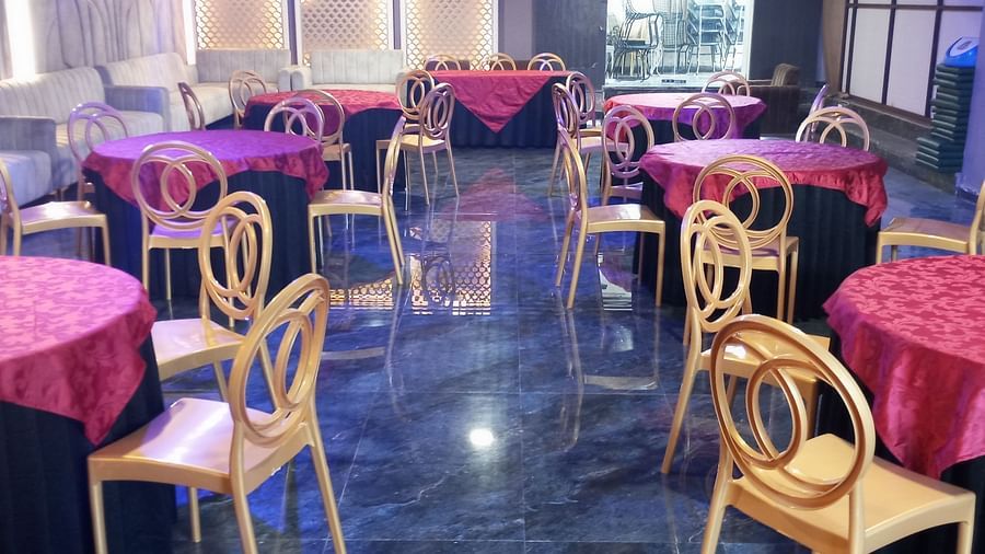 An image of Utsav Banquet hall with several chairs and table set- Bamboo Saa Mulberry Resort, Pushkar