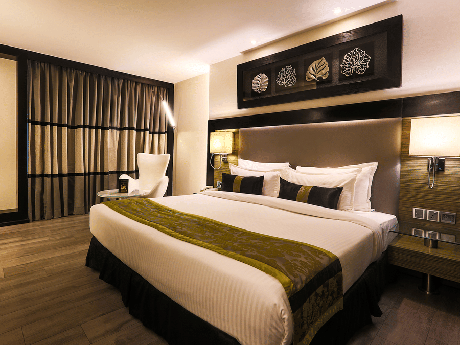 The Empresa Boutique Hotel - the king size bed offered by the Deluxe Room in Andheri