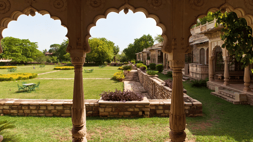 Deo Bagh - 17th Century, Gwalior - view of the garden in between the arches of a hallway