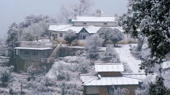 The facade view of Cliff House during snow fall -The Ramgarh Bungalows, Nainital.