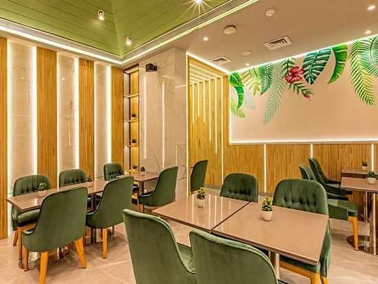 plush green interiors and cosy seating spaces at the origin cafe