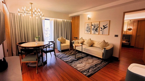Elegant Living Area with Comfortable Seating in Royal Suite at Pride Plaza Ahmedabad