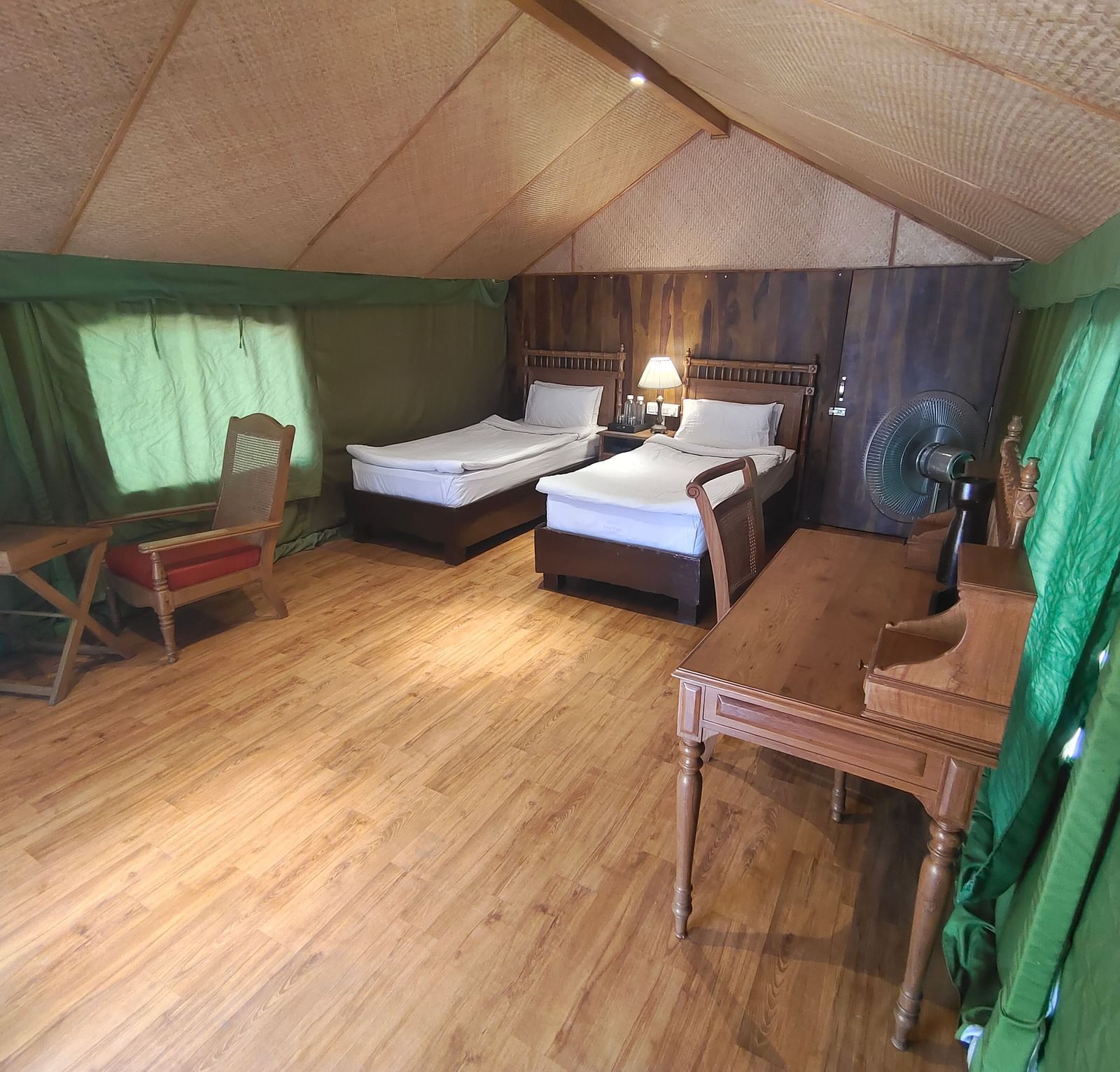 view of a tent with two single beds and workdesks - The Jamoon, Corbett