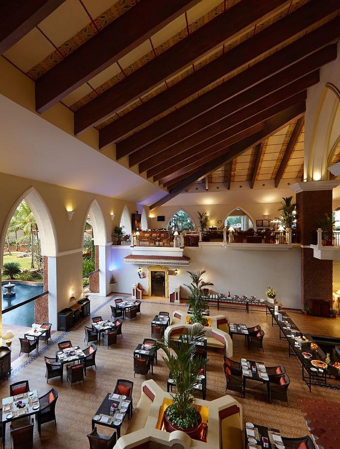 aerial view of the seating arrangements inside a restaurant - Caravela Beach Resort Goa