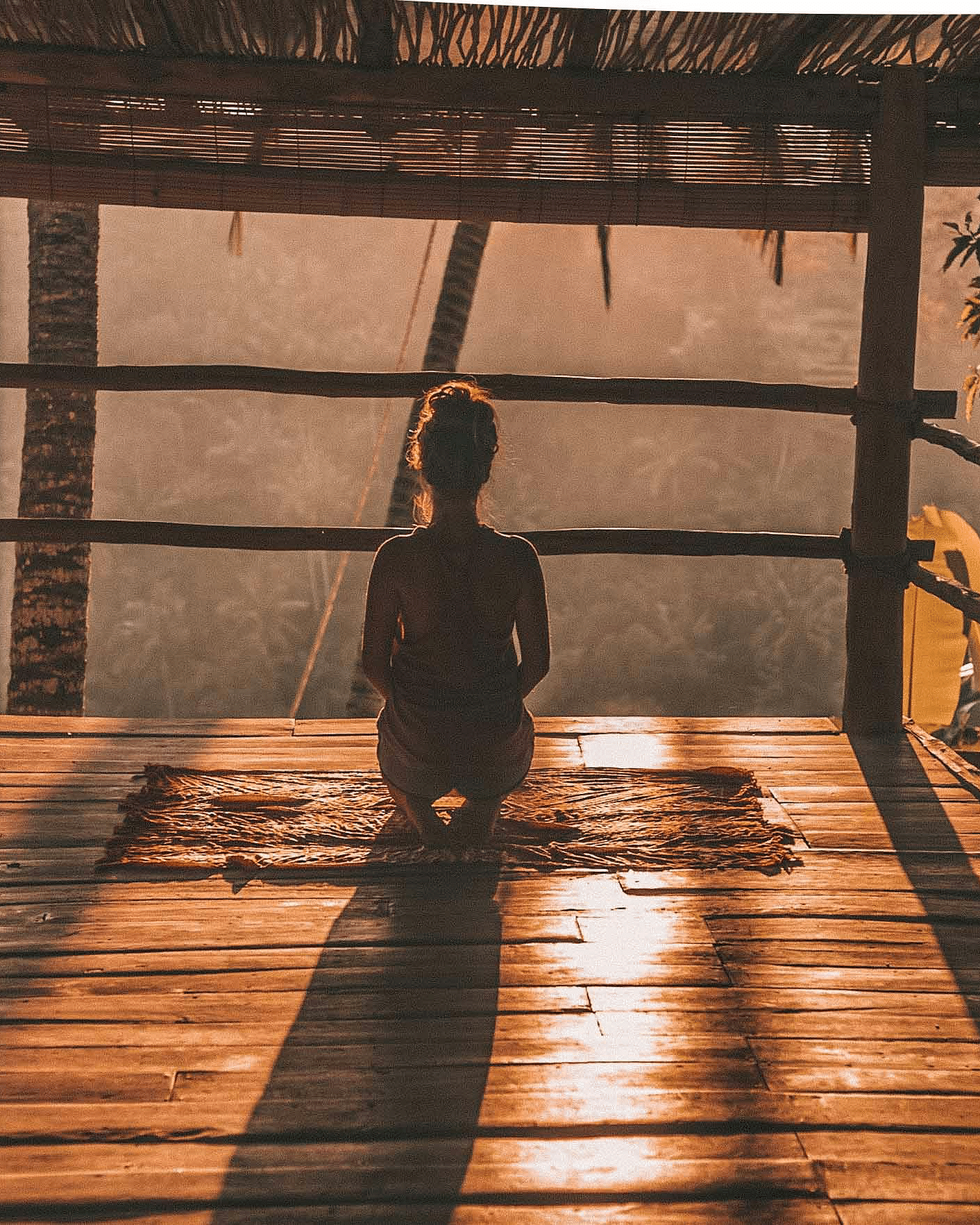 a person meditating in a gazebo