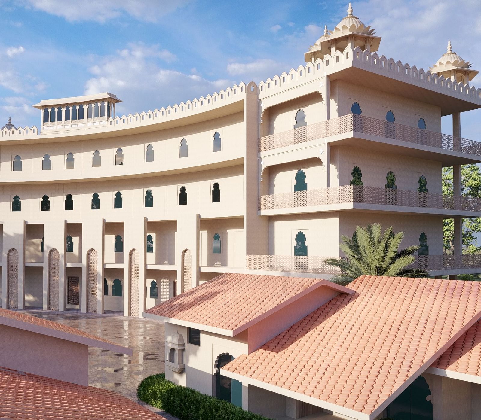Curved exterior of the large, multi-storey Bamboo Saa Sunrise Wedding & Wellness Resort, Jaipur, with a terracotta-tiled roof in the foreground.