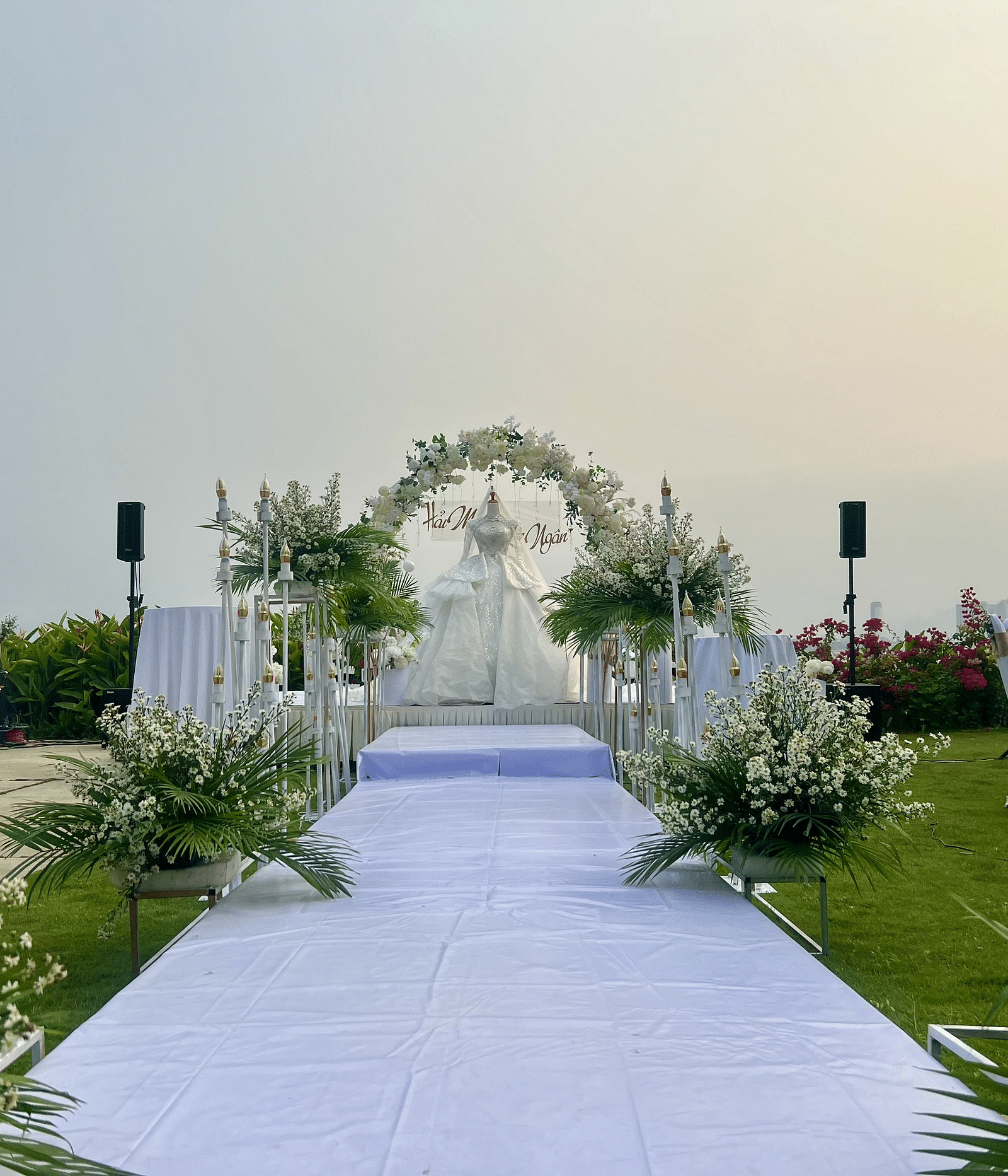 An image of an isle leading to a decorated platform - Alibu Resorts Nha Trang