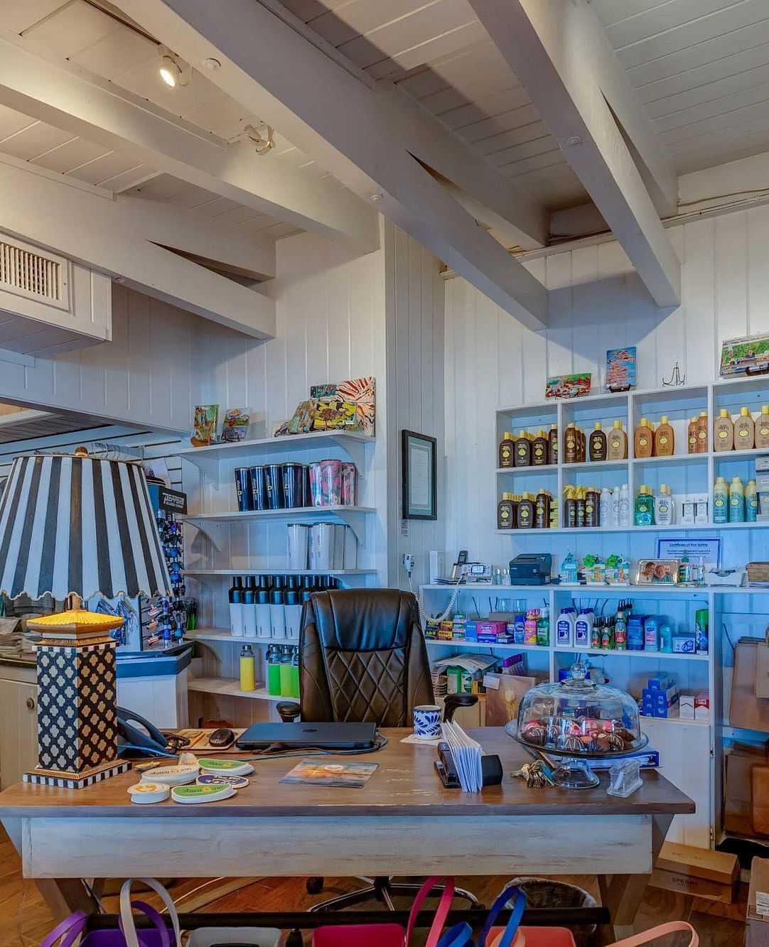 Retail space showing a large selection of casual clothing and beachwear items arranged in sections throughout the store.