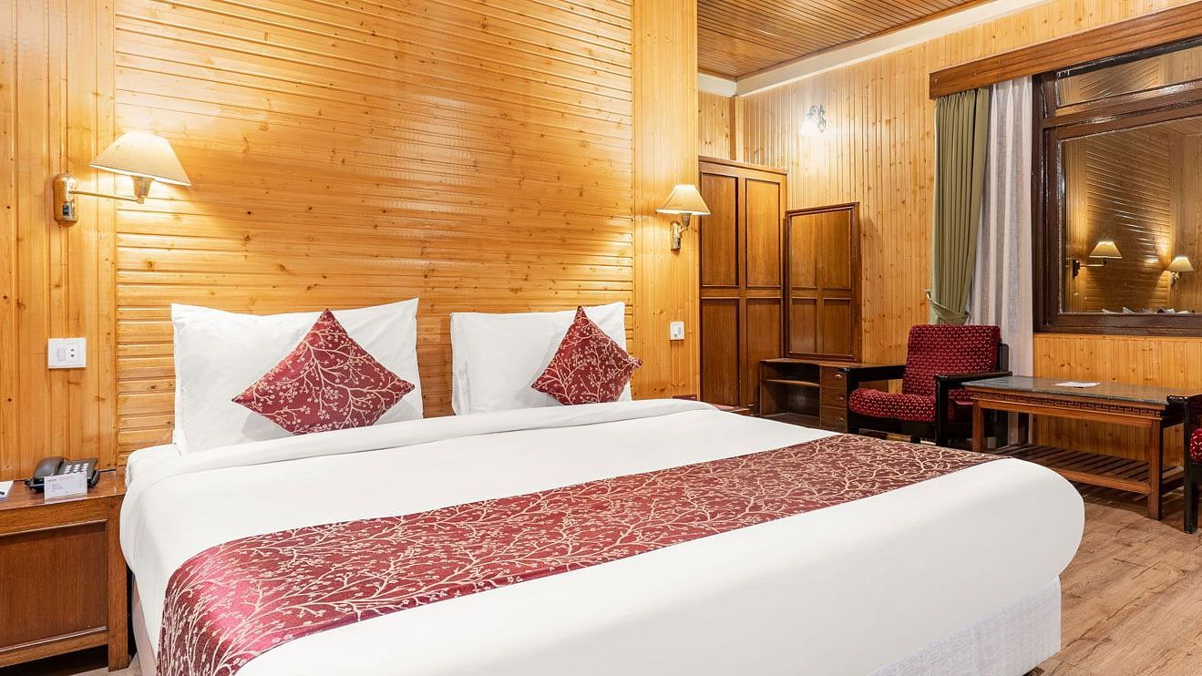 Image of a room with bed and sitting area at Summit Tashi Ghang Heritage Resort, Pelling
