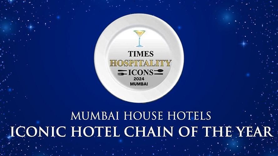 A background with a  plate in the center, displaying the Times Hospitality Icon 2024 logo. The text MUMBAI HOUSE HOTELS and ICONIC HOTEL CHAIN OF THE YEAR is displayed below.