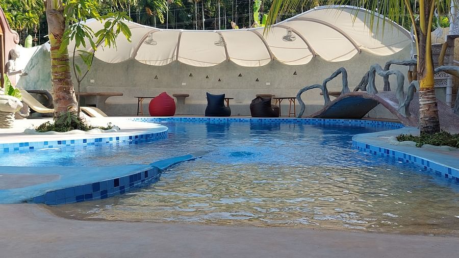 erene poolside oasis with abundant tropical plants- Matsya Island Retreat by Island Quest.
