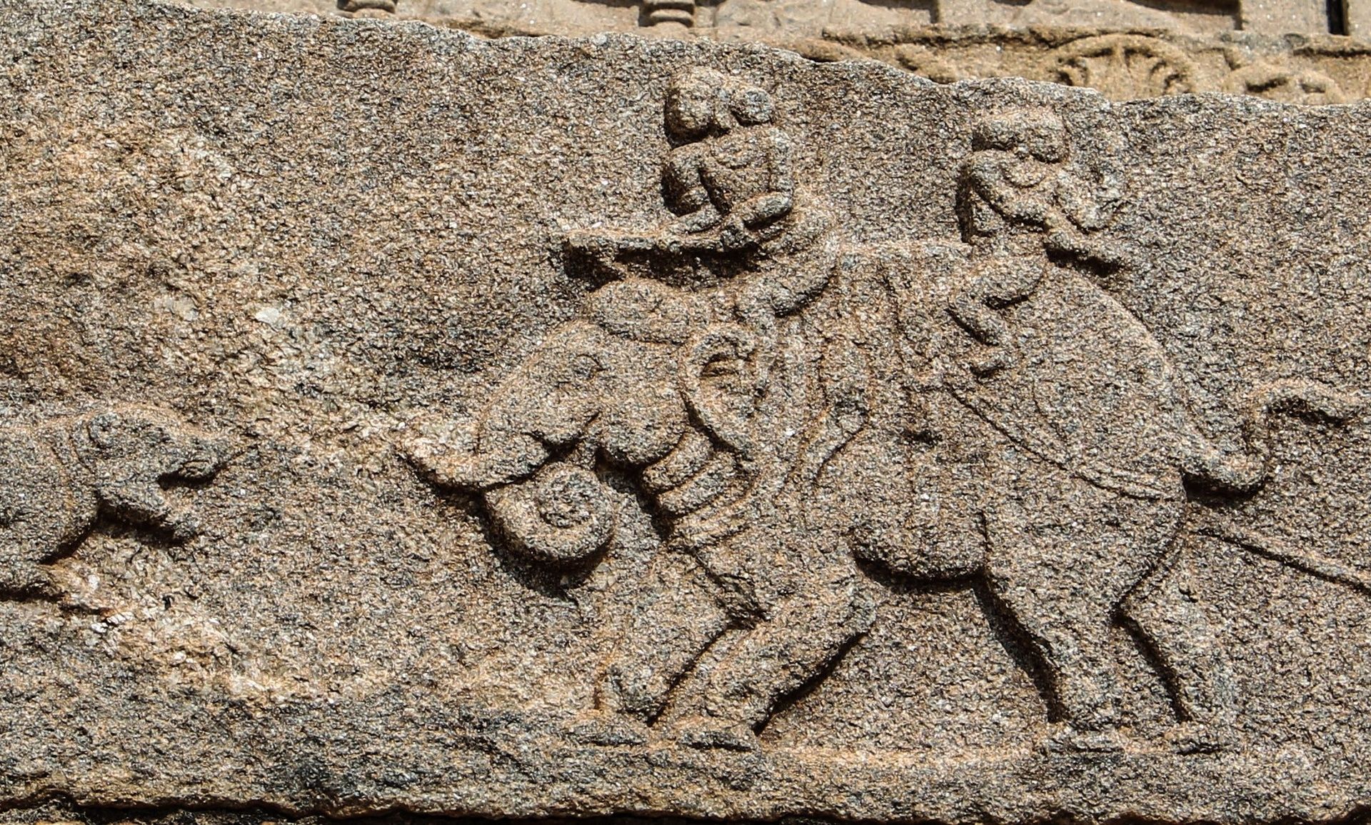 Hampi stone bas-relief of an elephant hunting scene.