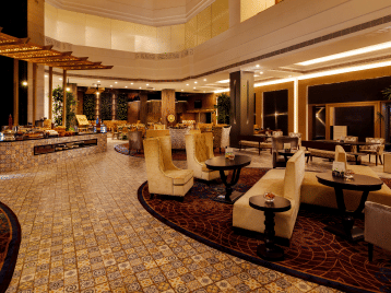 Lobby view with sofas at Grand Chennai By GRT Hotels.