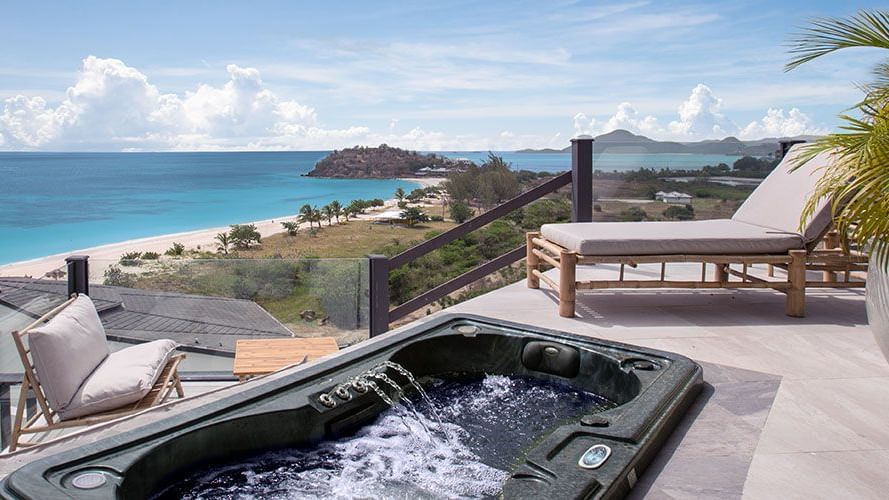 Jacuzzi on a private terrace with sweeping beach views at Tamarind Hills Antigua – Resort & Villas