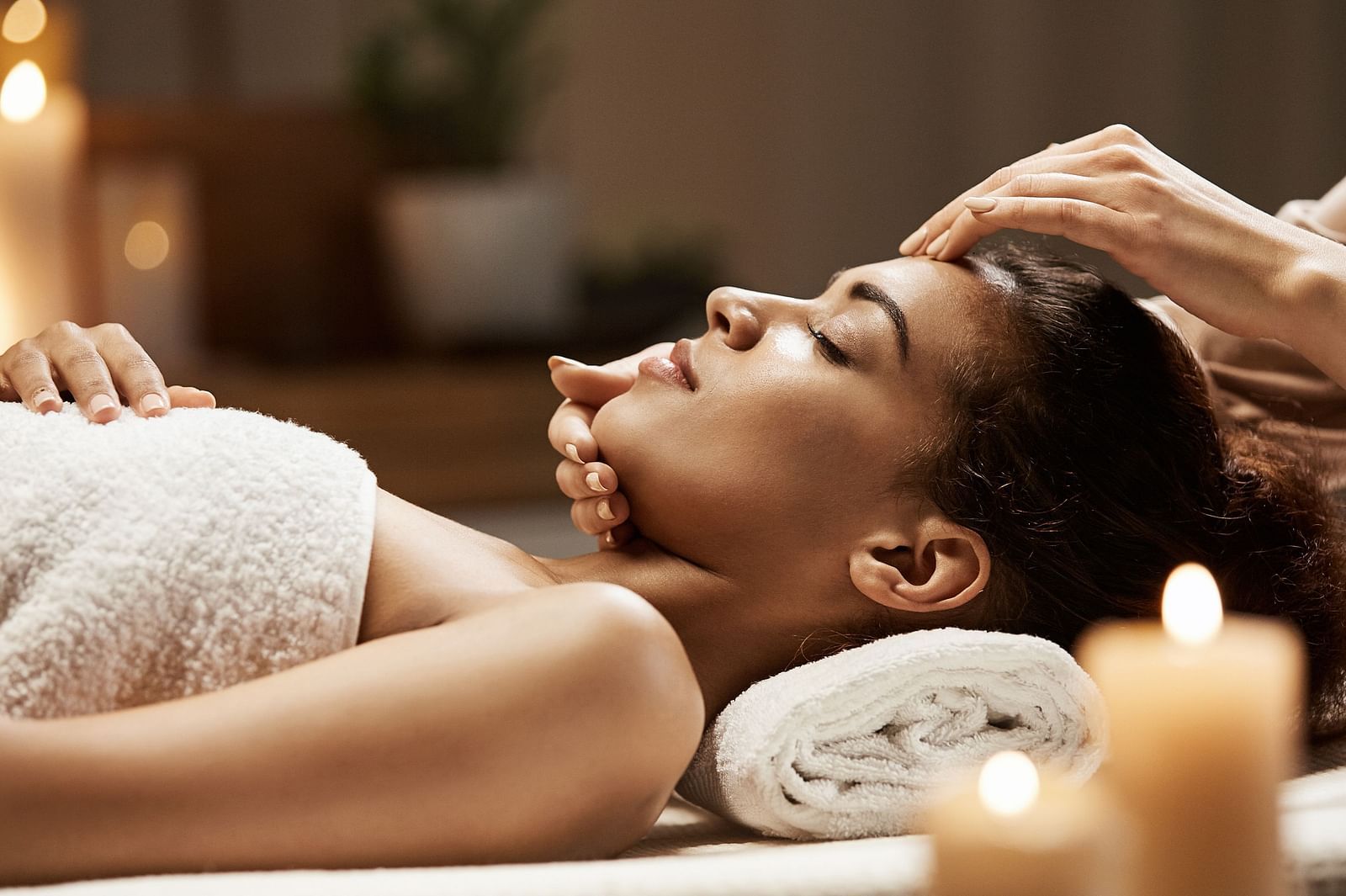 attractive-african-woman-enjoying-face-massage-spa-salon