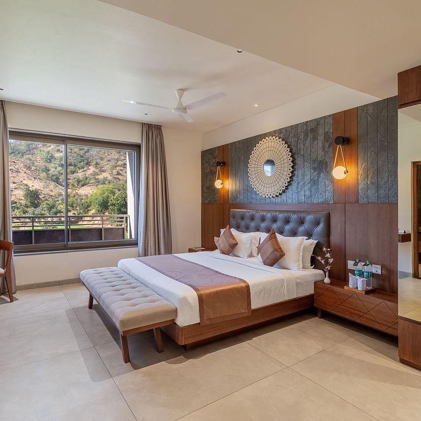 view of a king size bed and TV of Suite at Stone Wood Hotel, Kumbhalgarh