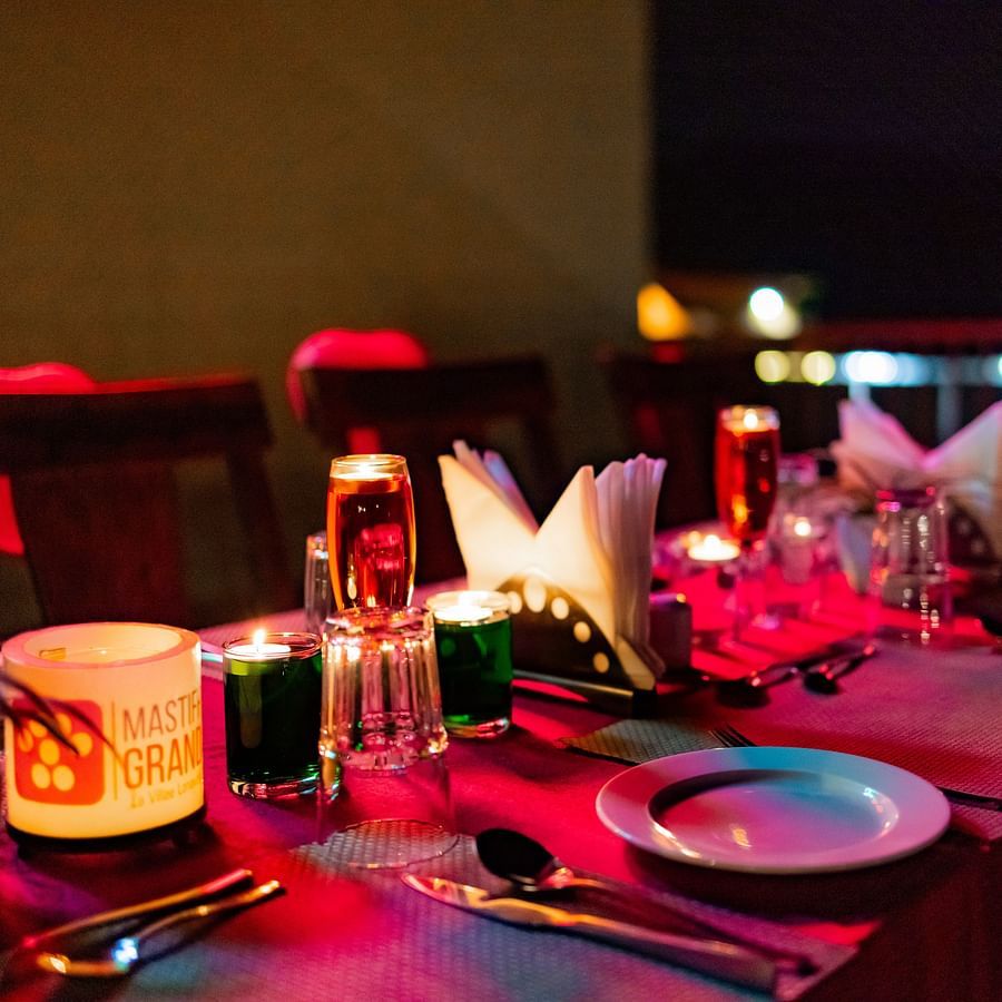 Table setup with detailed place settings and décor, ideal for a festive dining experience - Mastiff Grand La Villae Resort, Lonavala