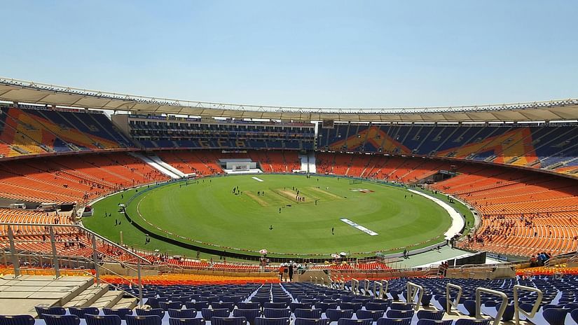  A view of the cricket stadium from the top-tier seating, capturing the entire field and atmosphere below.