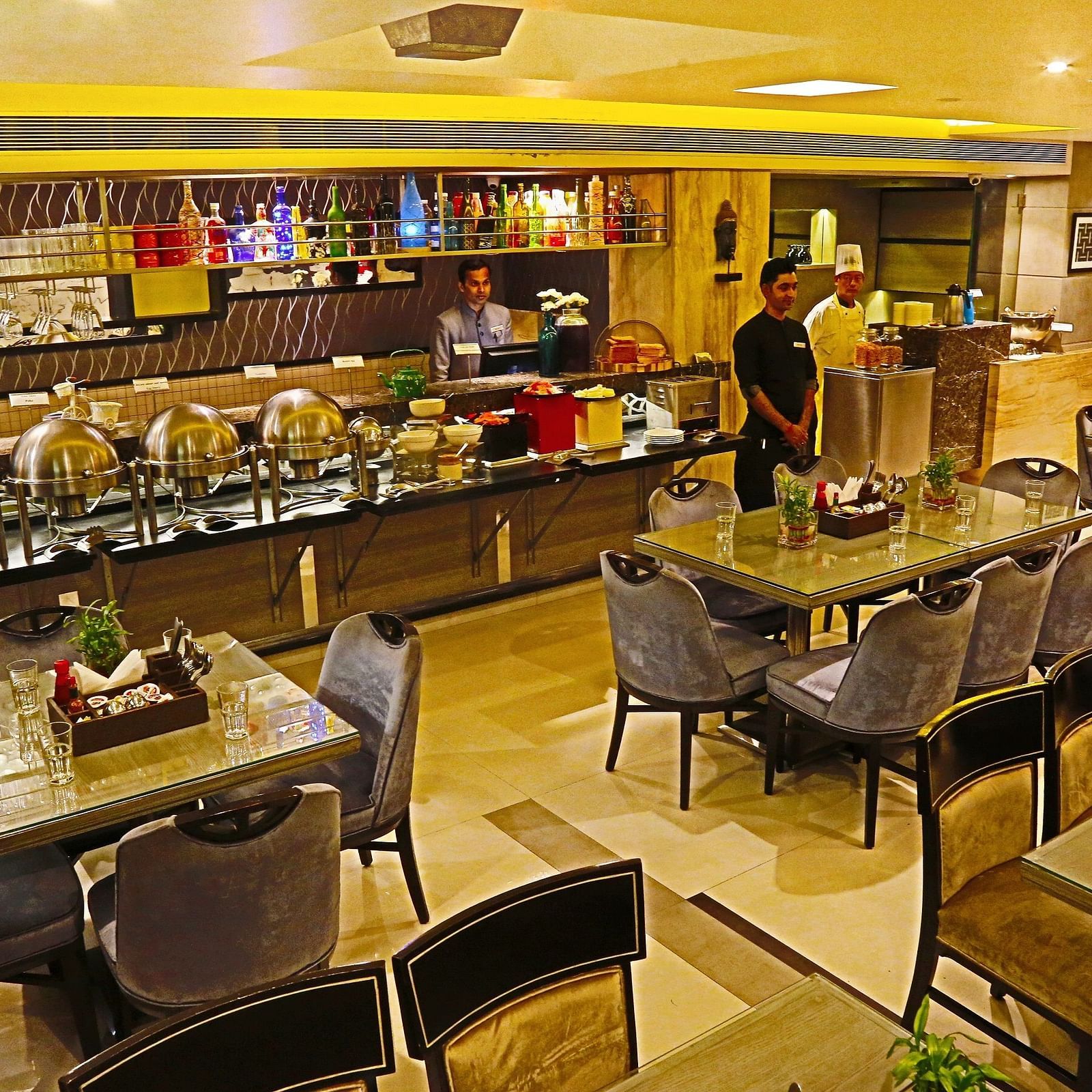 Image of a dining space with chairs and tables at The Oriental Residency