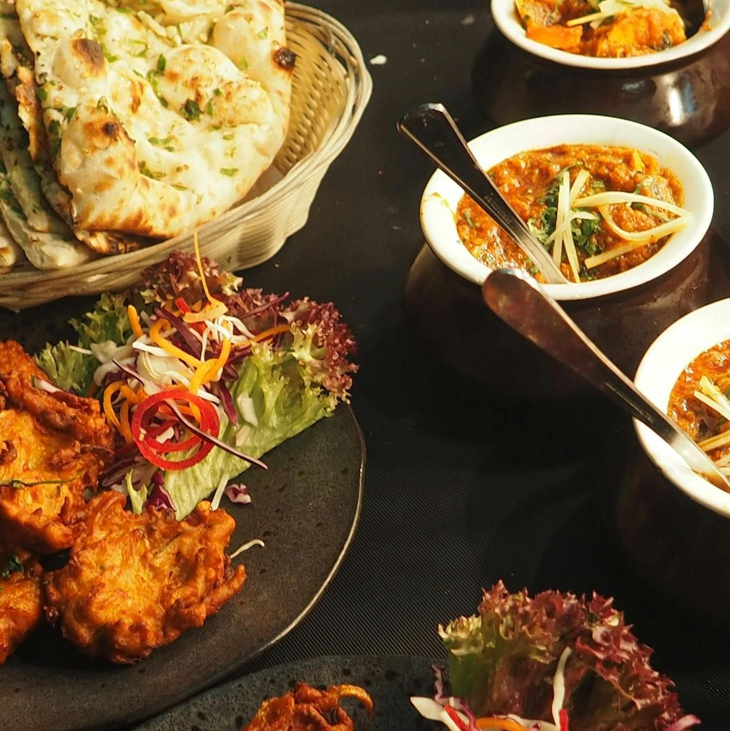 An image of various dishes placed on the table | Inde Hotel Golf Course Extension