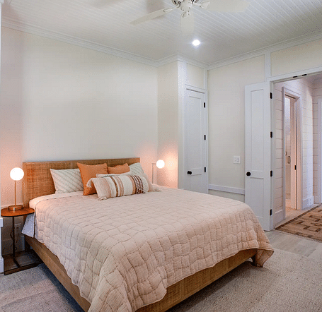 Bedroom with a double bed, bedside lamps, and a ceiling fan | Abaco Inn