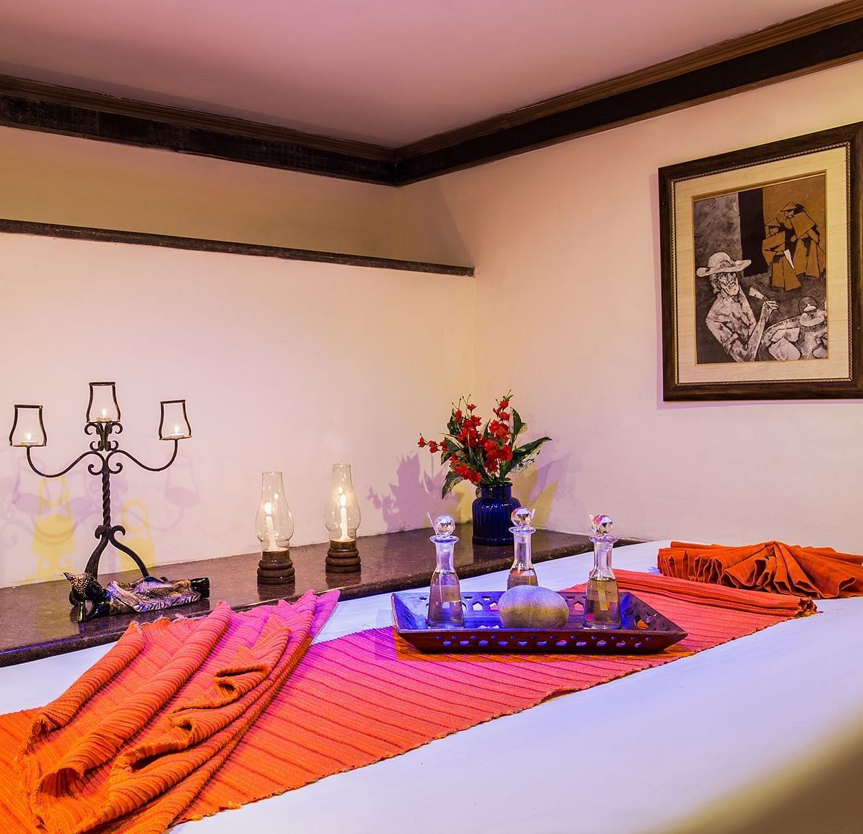 A spa table and candles beside it in a treatment room at our Spa in Nainital