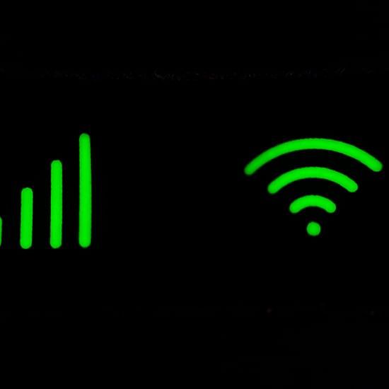 A green Wi-Fi symbol against a black background
