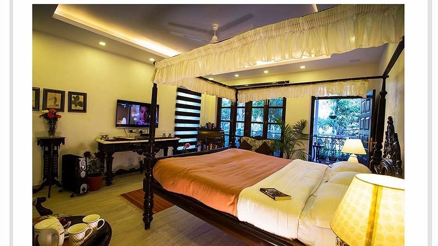 Image of interior of a Hotel Room with bed at Shaheen Bagh Resort Dehradun