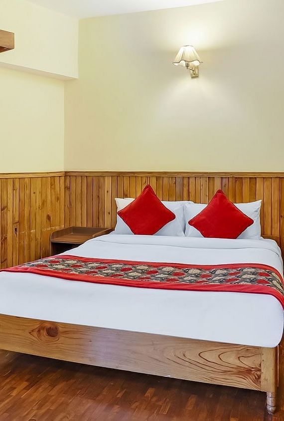 A front view of a bed in a room | Summit Newa Regency & Spa, Pelling