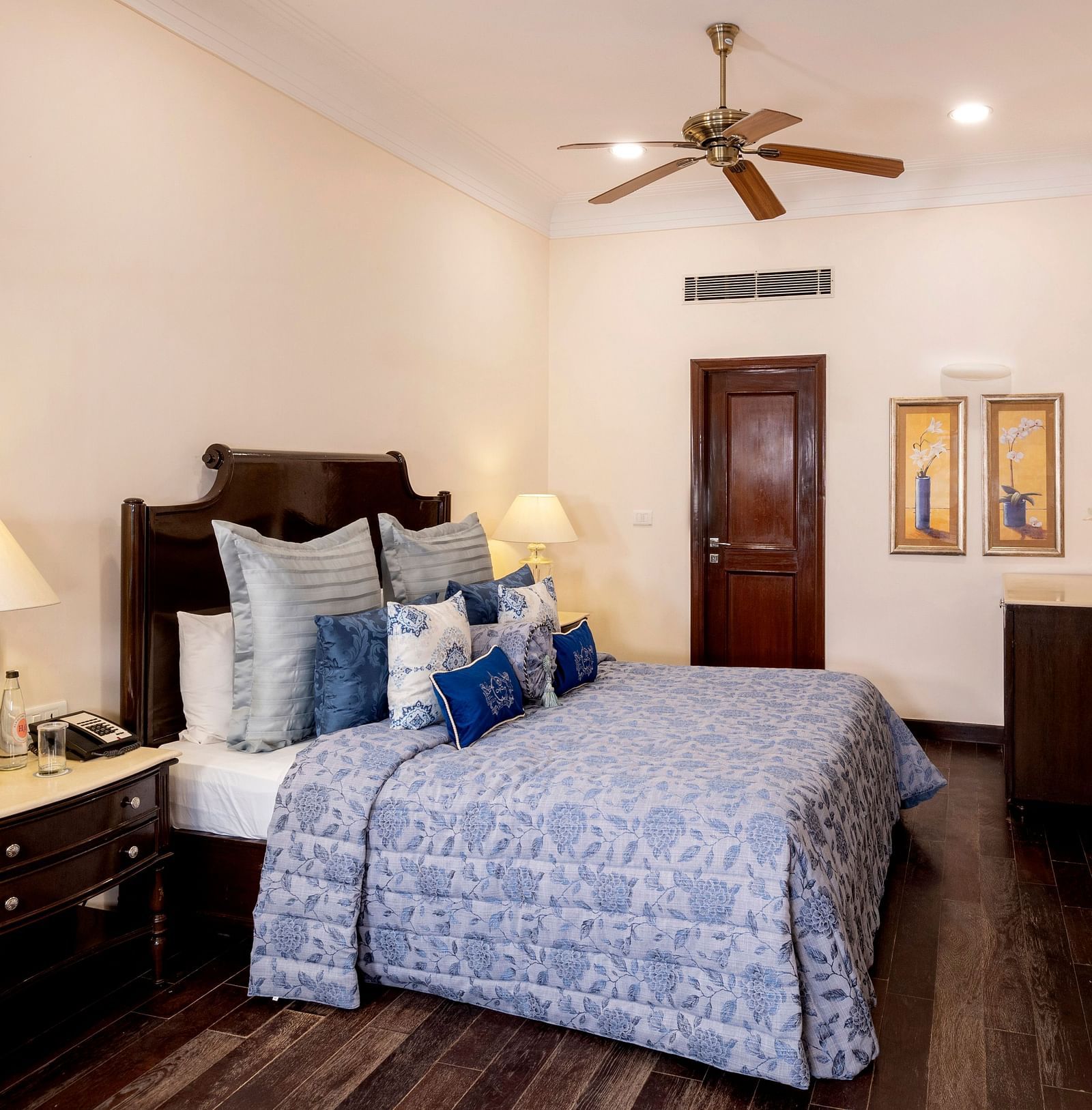 image of a king size bed at the Claridges Room with a wall mounted television at The Claridges Nabha Residence